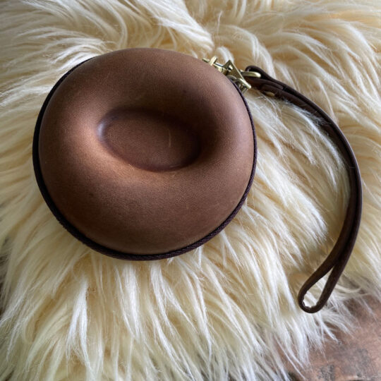 Handmade retro leather donut-shaped watch case. Carries one watch.