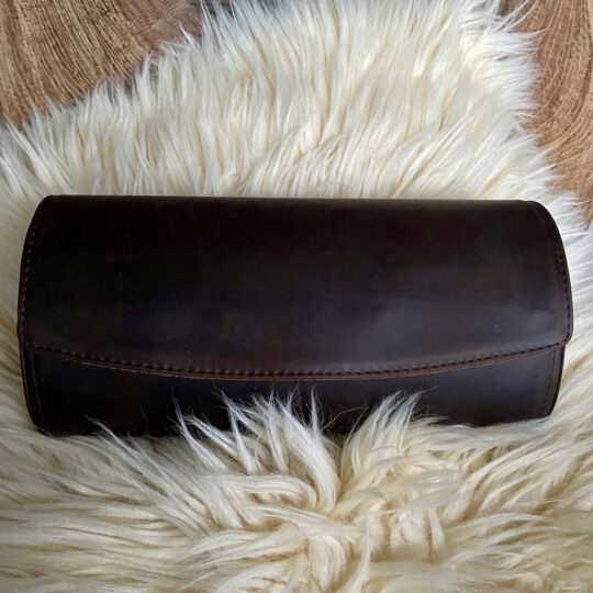 Egg shaped watch case that fits 3 watches. Coffee colour genuine cowhide leather, processed "Crazy Horse" style.